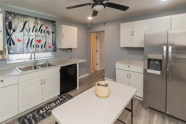 a bathroom with a toilet and a shower curtain