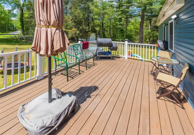 a view of outdoor space with deck and wooden floor