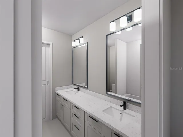 a bathroom with a double vanity sink and mirror