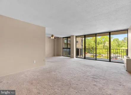 a view of an empty room with a large window