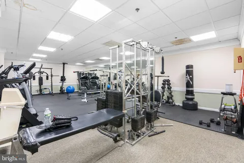 a room with gym equipment and view of gym equipment