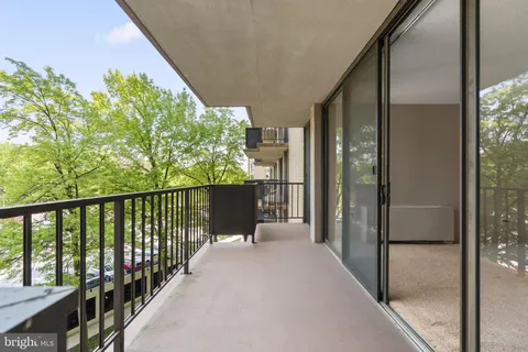 a view of a balcony with wooden floor