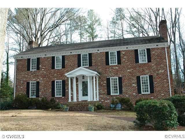 10319 Cherokee Road Richmond, VA 23235 - Photo 1 of 12 a front view of a house with yard and trees