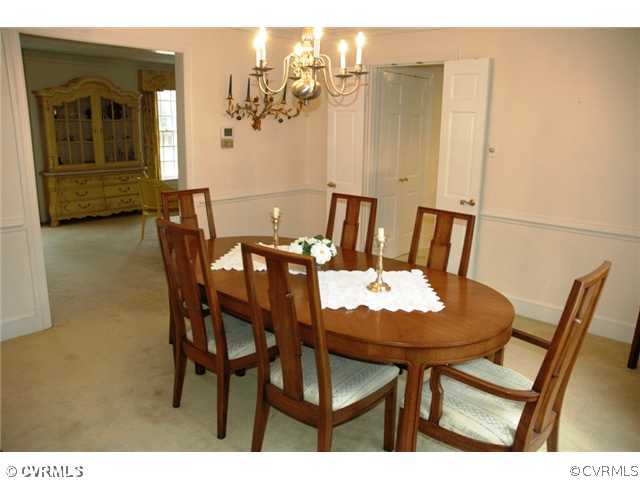 10319 Cherokee Road Richmond, VA 23235 - Photo 5 of 12 a view of a dining room with furniture and wooden floor