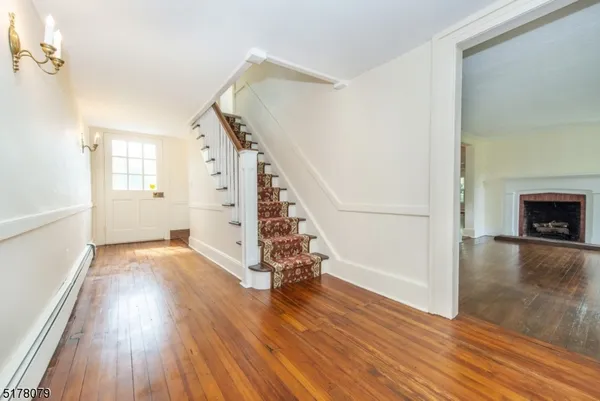 a view of entryway with wooden floor