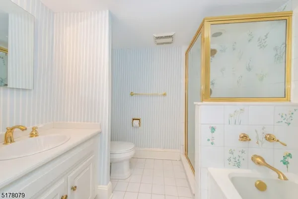 a bathroom with a sink a toilet and a bathtub