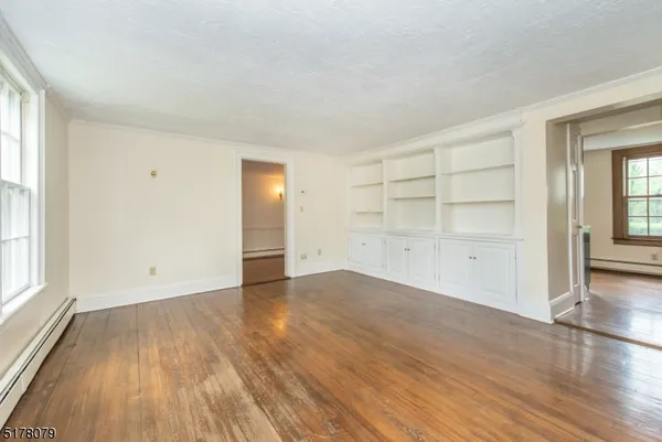 an empty room with wooden floor