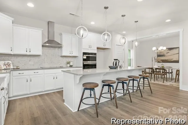 a kitchen with cabinets a sink and appliances