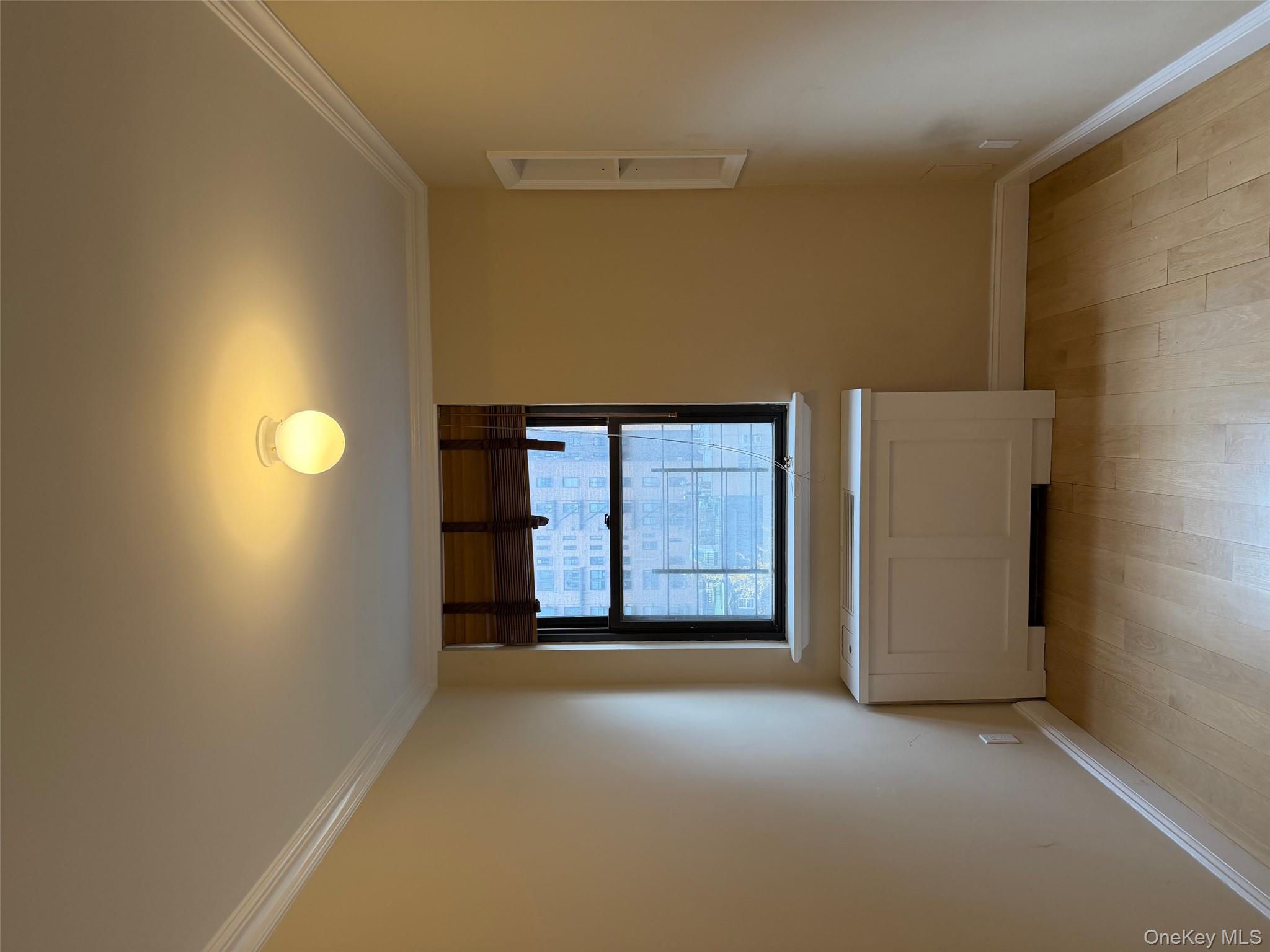 420 East 51st Street, Unit 8DE Manhattan, NY 10022 - Photo 13 of 17 a room with a window