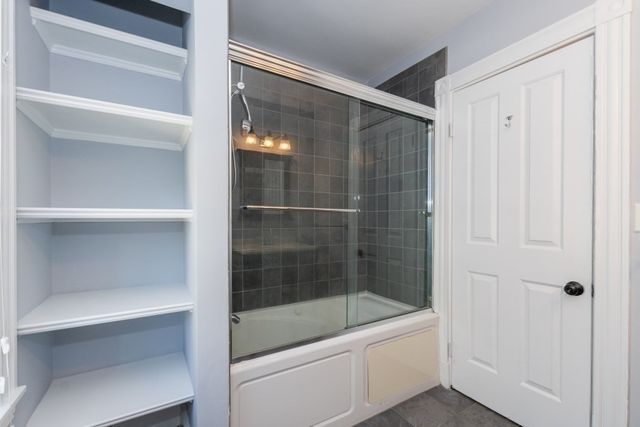 a bathroom with a sink vanity and a toilet