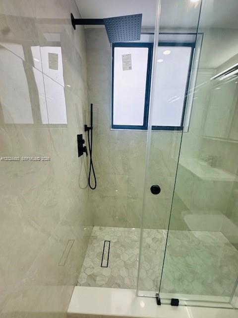 11870 Southwest 5th Street, Unit A Miami, FL 33184 - Photo 11 of 18 a bathroom with a shower