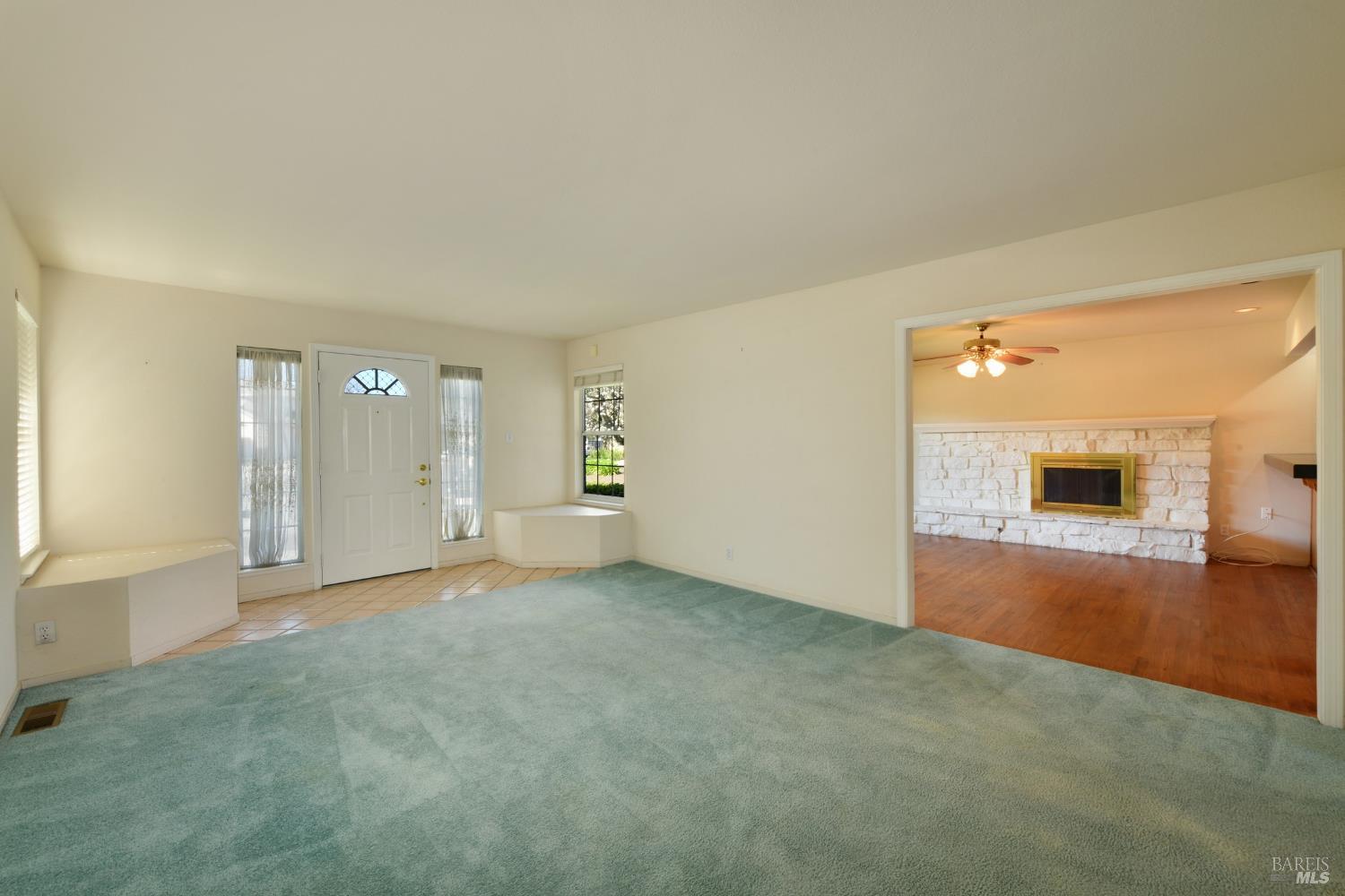 135 Fulton Place Windsor, CA 95492 - Photo 17 of 41 a view of empty room with wooden floor and windows