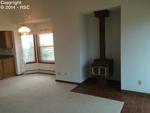 9815 Raygor Road Colorado Springs, CO 80908 - Photo 6 of 17 Family room and eat-in area off of kitchen