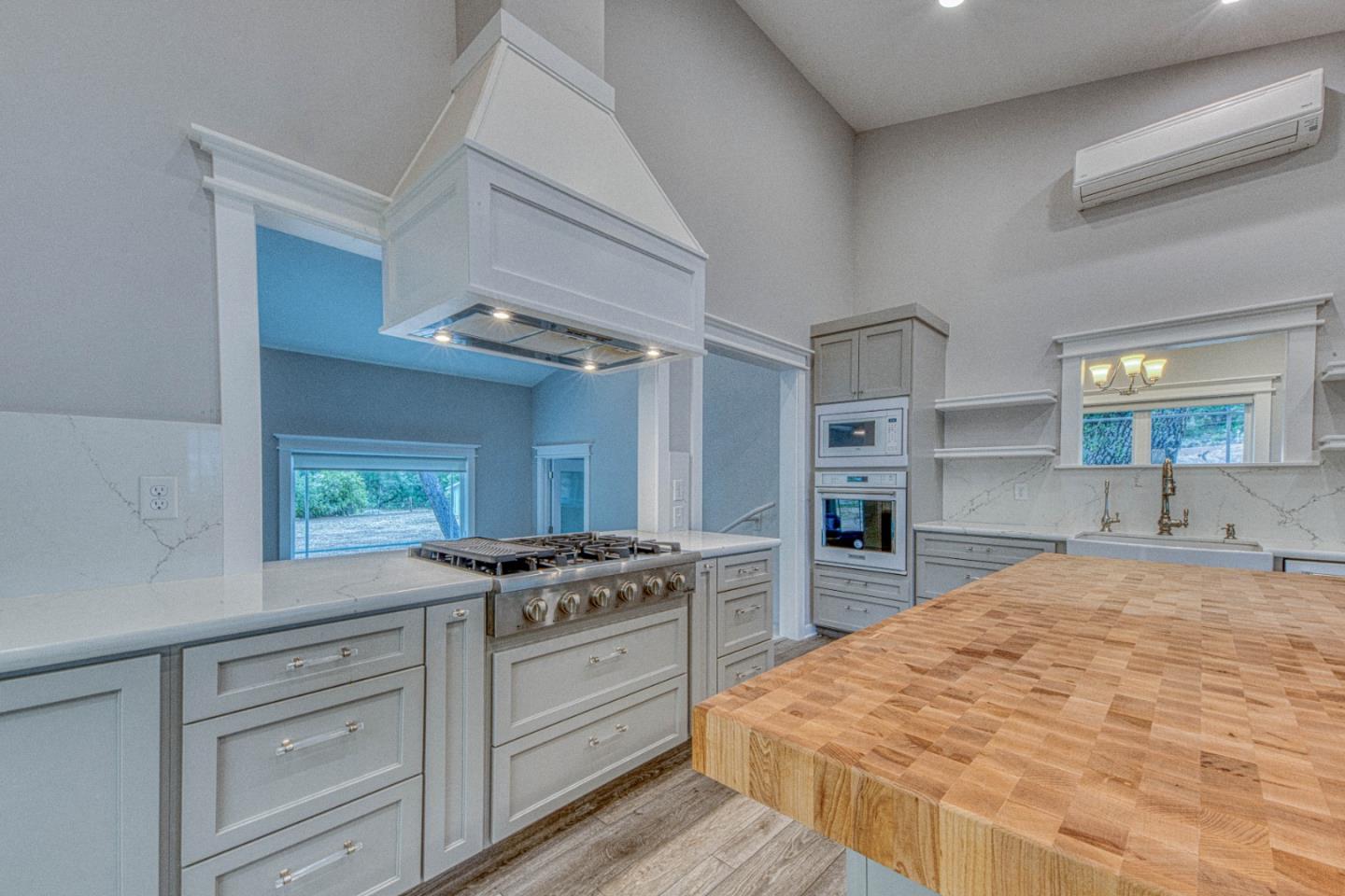 47317 Arroyo Seco Road Greenfield, CA 93927 - Photo 6 of 47 a kitchen with stainless steel appliances granite countertop a stove and a sink