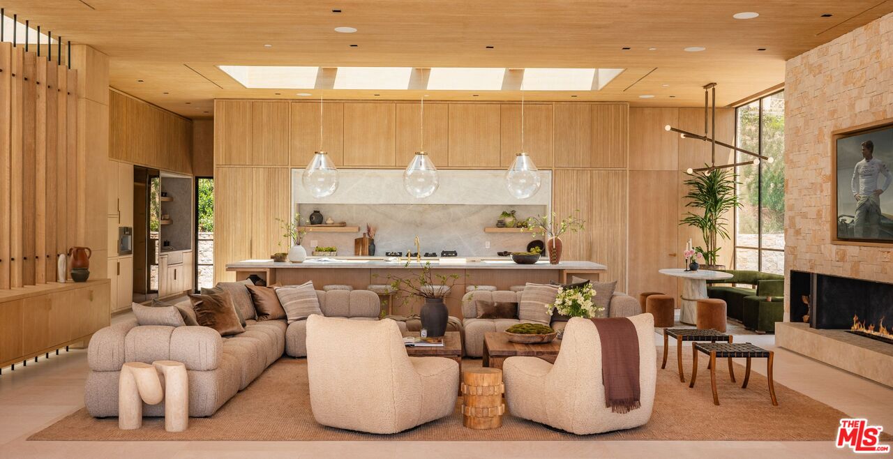 1039 Wallace Ridge Beverly Hills, CA 90210 - Photo 11 of 56 a living room with furniture a flat screen tv and a table