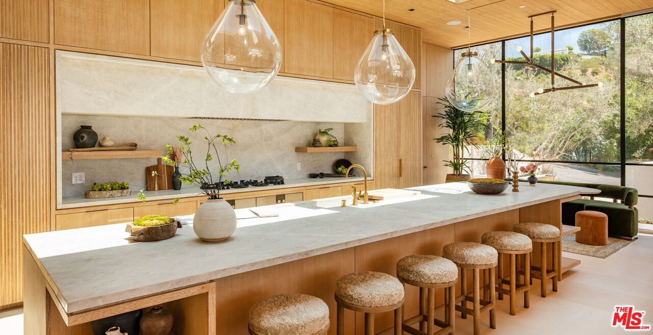 1039 Wallace Ridge Beverly Hills, CA 90210 - Photo 12 of 56 a kitchen with a table and chairs