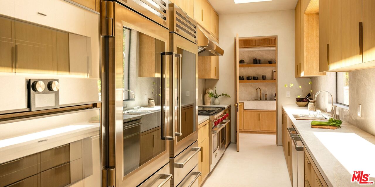 1039 Wallace Ridge Beverly Hills, CA 90210 - Photo 13 of 56 a kitchen with a refrigerator and a sink