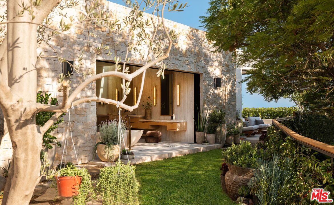 1039 Wallace Ridge Beverly Hills, CA 90210 - Photo 21 of 56 a front view of a house with garden