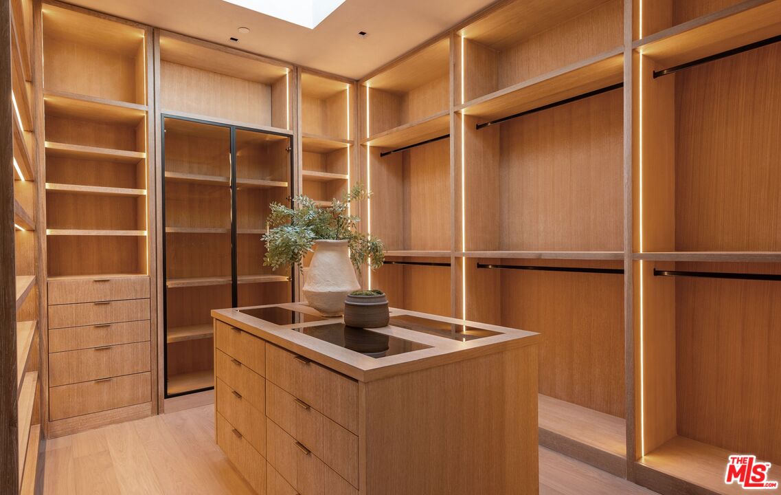 1039 Wallace Ridge Beverly Hills, CA 90210 - Photo 22 of 56 a kitchen with a refrigerator and cabinets
