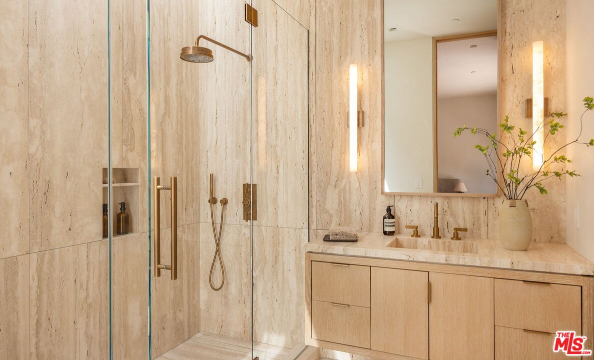 1039 Wallace Ridge Beverly Hills, CA 90210 - Photo 24 of 56 a bathroom with a double vanity sink and a mirror