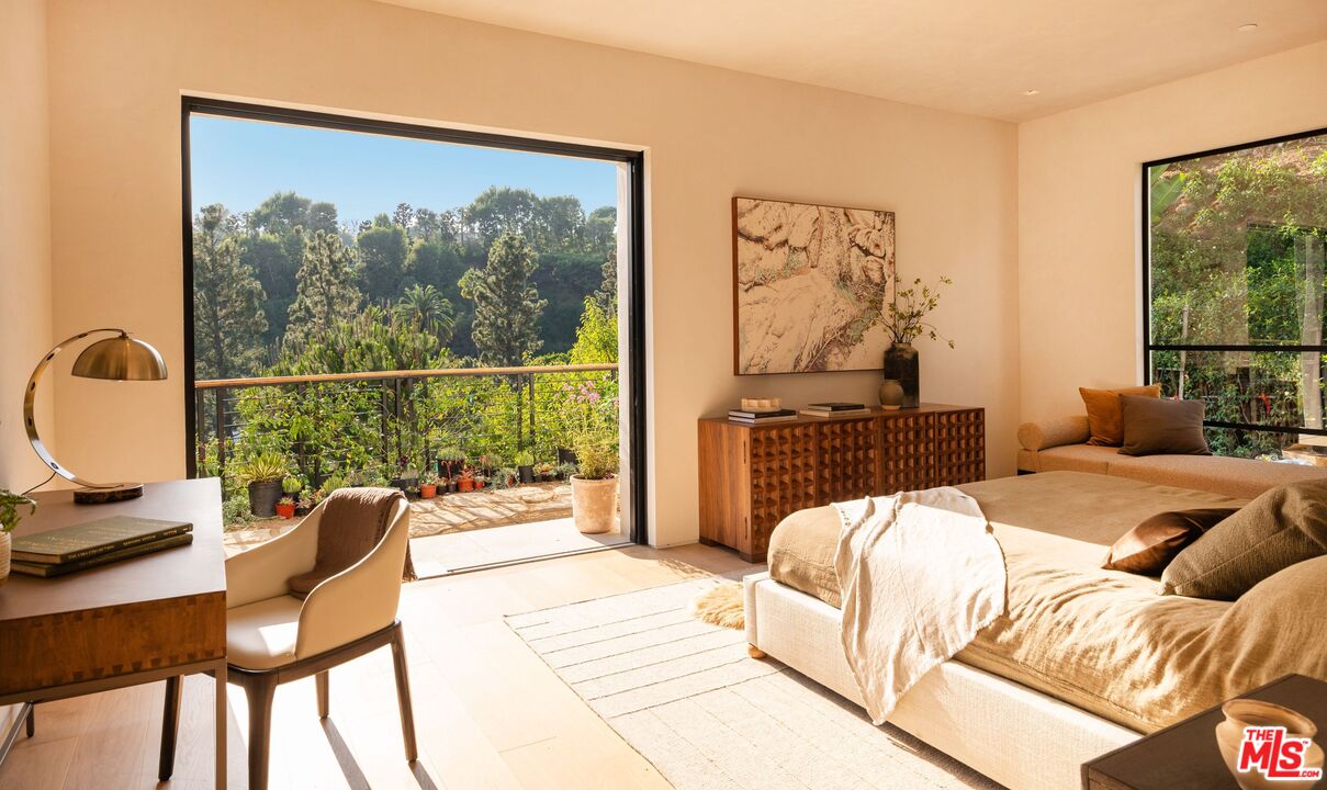 1039 Wallace Ridge Beverly Hills, CA 90210 - Photo 25 of 56 a bedroom with a bed and a large window