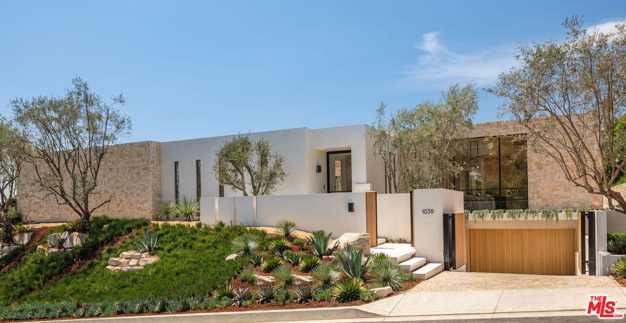 1039 Wallace Ridge Beverly Hills, CA 90210 - Photo 3 of 56 a front view of a house with garden