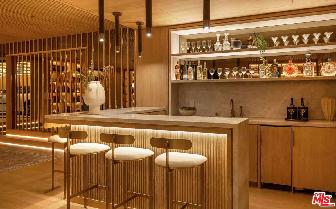 1039 Wallace Ridge Beverly Hills, CA 90210 - Photo 35 of 56 a view of a kitchen with a table and chairs