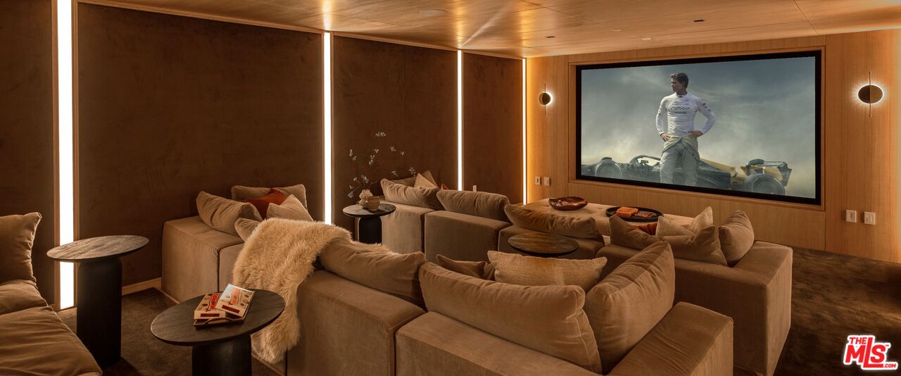 1039 Wallace Ridge Beverly Hills, CA 90210 - Photo 37 of 56 a living room with furniture and wall painting