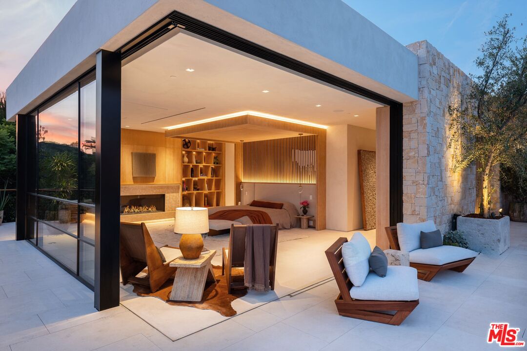 1039 Wallace Ridge Beverly Hills, CA 90210 - Photo 42 of 56 a living room with furniture and a floor to ceiling window