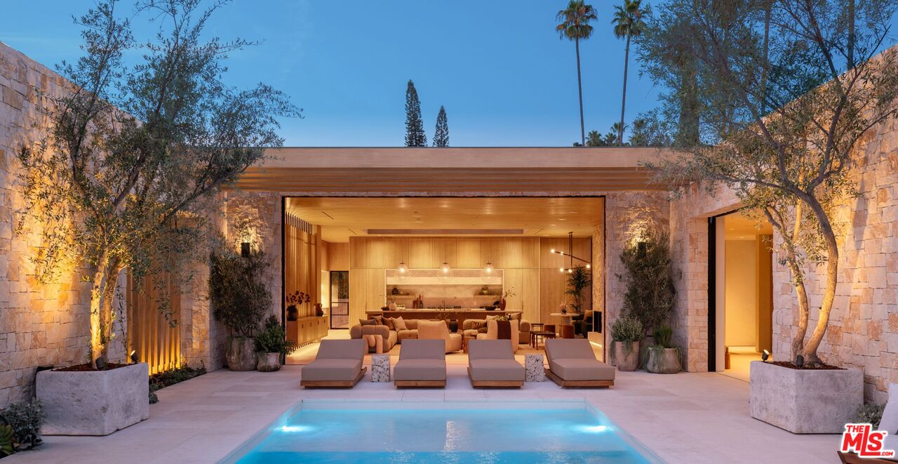 1039 Wallace Ridge Beverly Hills, CA 90210 - Photo 44 of 56 a view of a patio with couches and potted plants