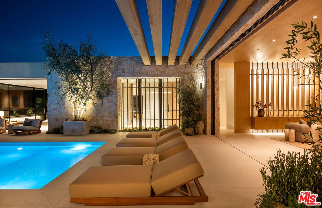 1039 Wallace Ridge Beverly Hills, CA 90210 - Photo 54 of 56 a bedroom with a bed and window