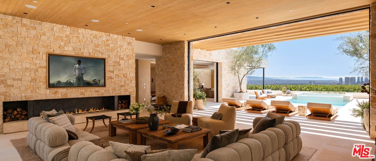 1039 Wallace Ridge Beverly Hills, CA 90210 - Photo 7 of 56 a living room with furniture and a floor to ceiling window