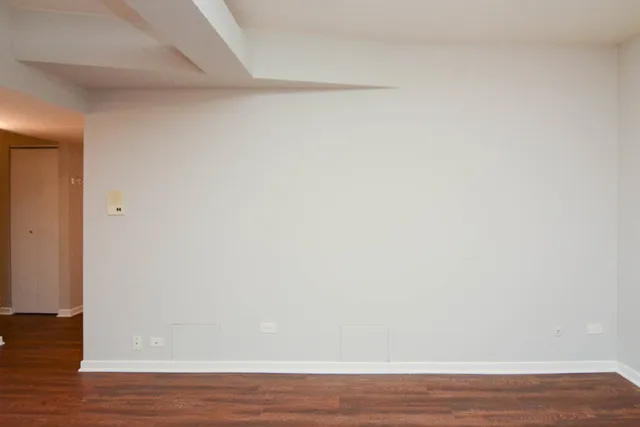 a view of a small space with wooden floor