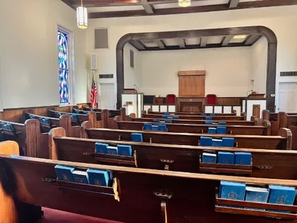 a view of dinning table with chairs