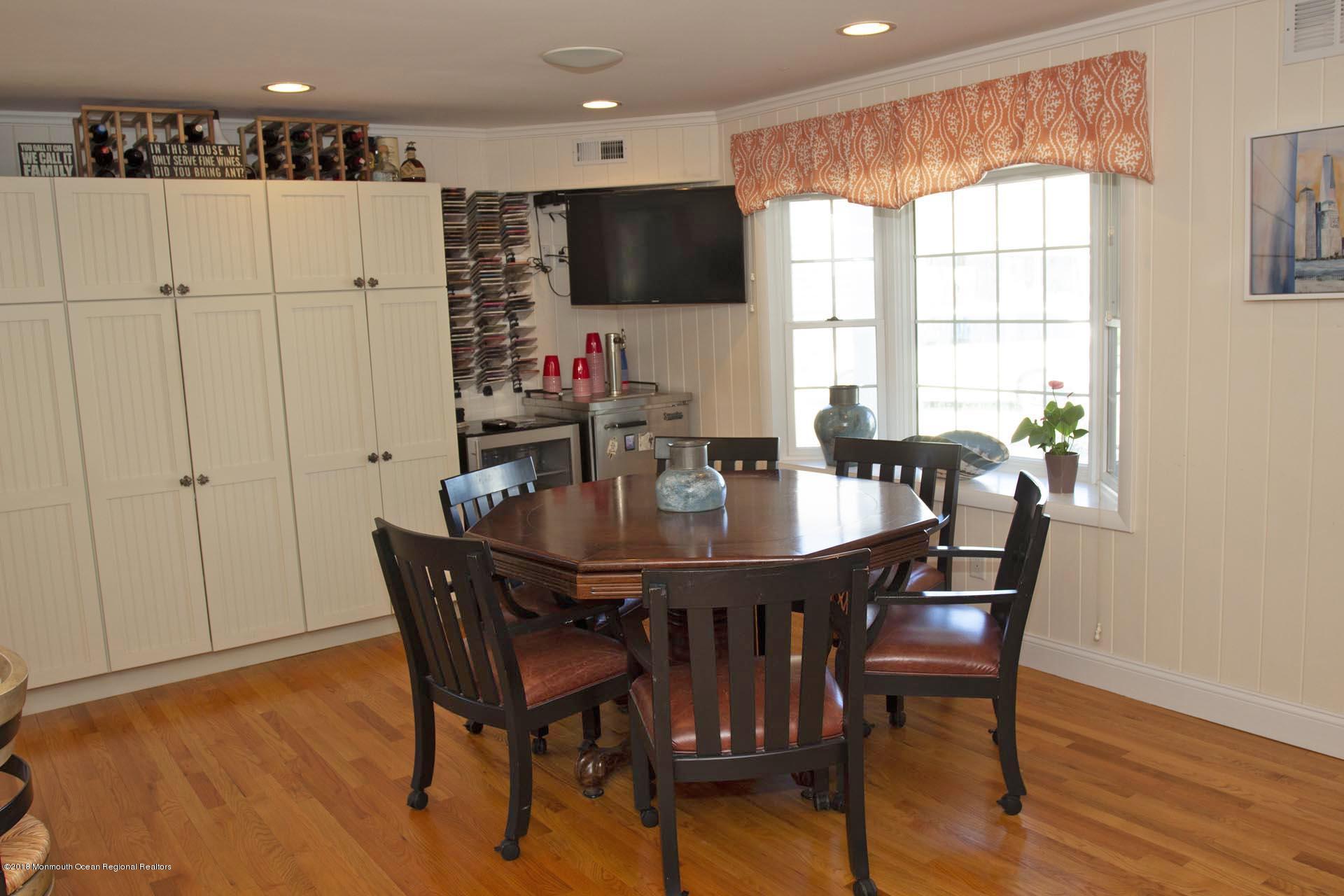 52 Fishermans Road Lavallette, NJ 08735 - Photo 18 of 74 a view of a dining room with furniture and wooden floor