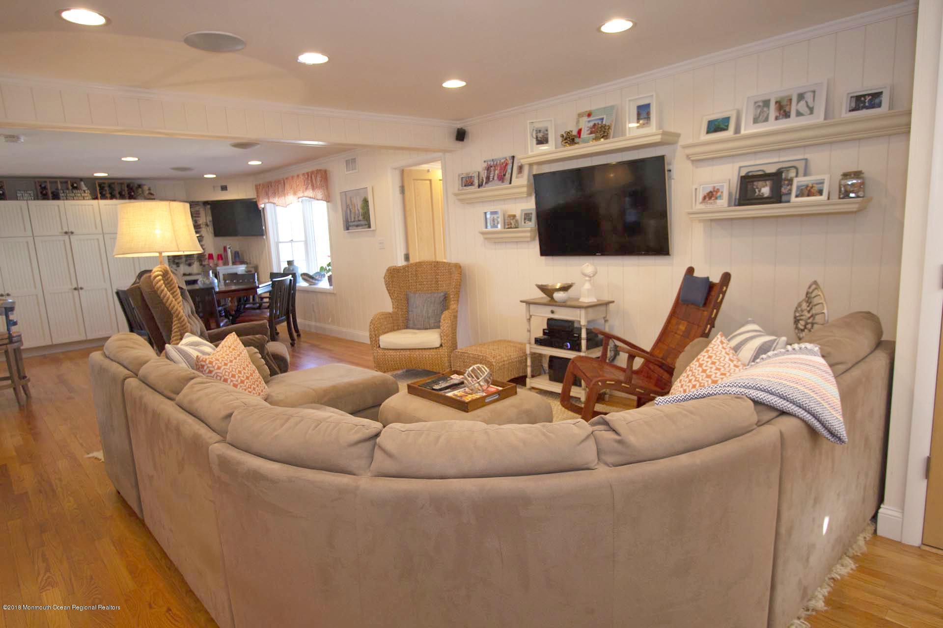 52 Fishermans Road Lavallette, NJ 08735 - Photo 21 of 74 a living room with furniture kitchen view and a flat screen tv