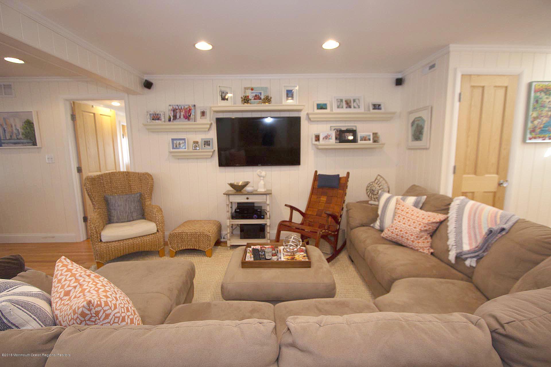52 Fishermans Road Lavallette, NJ 08735 - Photo 22 of 74 a living room with furniture and a flat screen tv