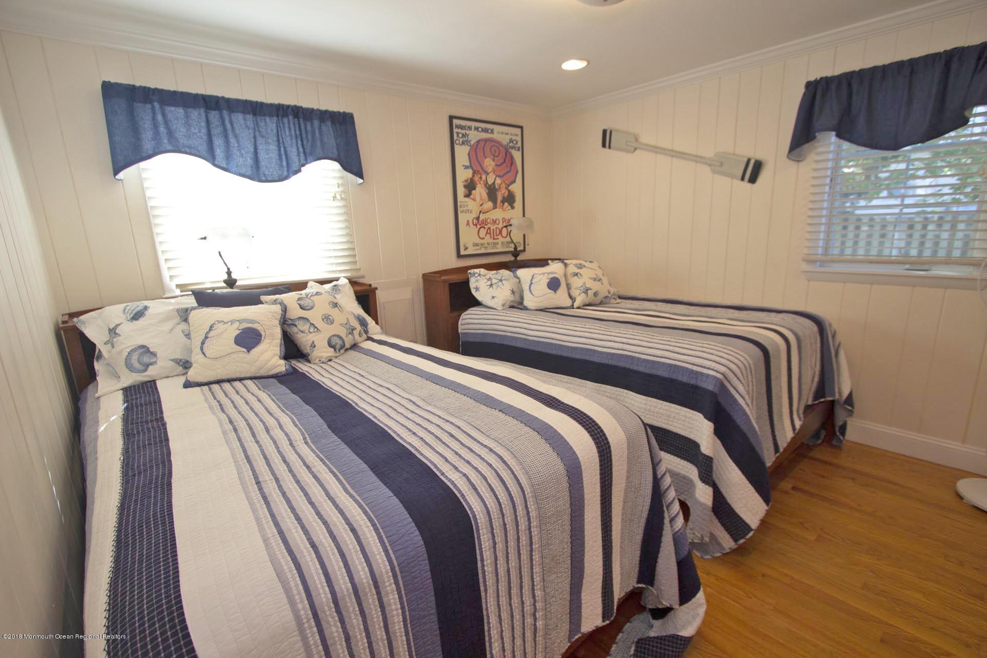 52 Fishermans Road Lavallette, NJ 08735 - Photo 25 of 74 a bedroom with a bed and a window