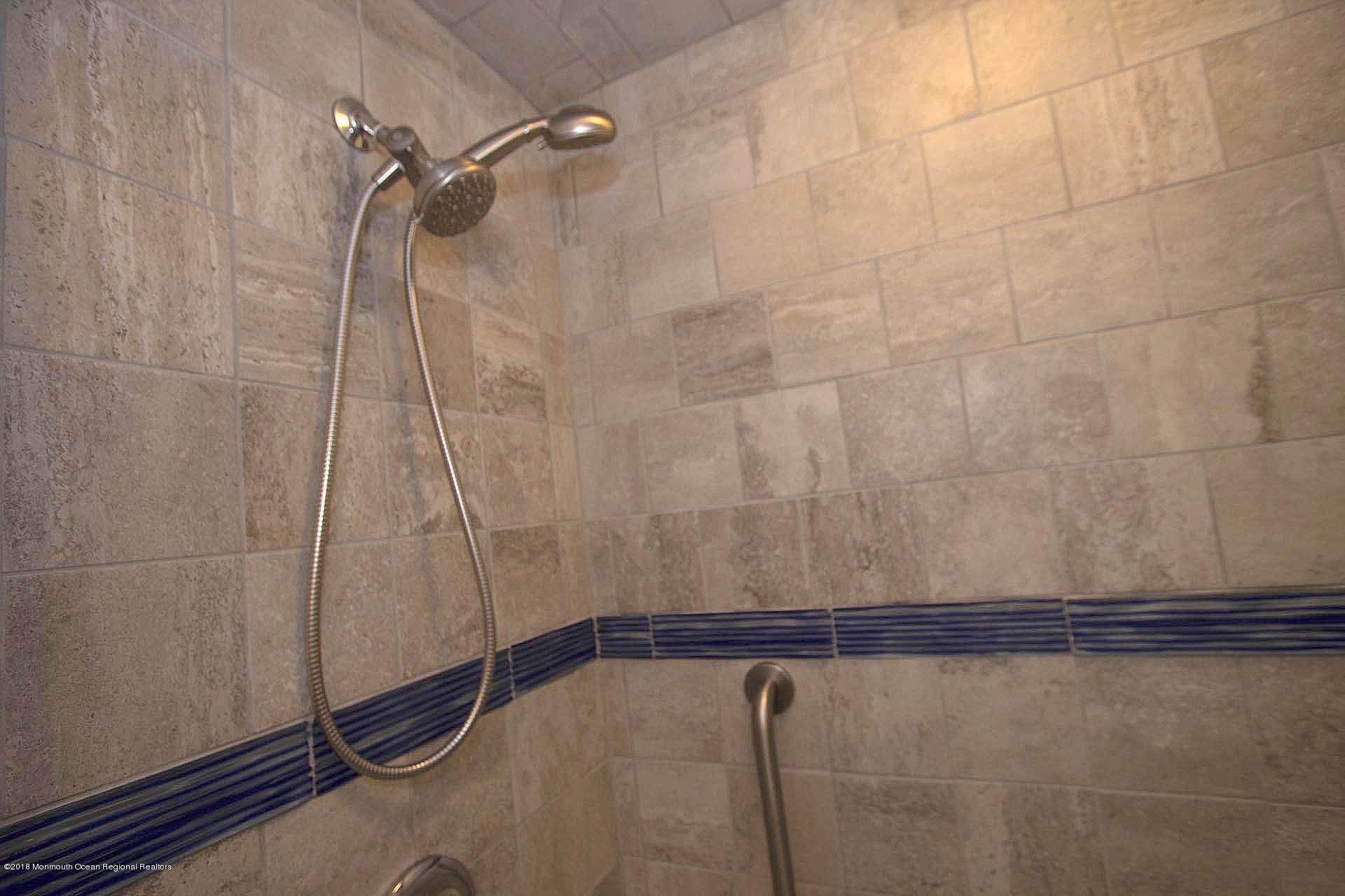 52 Fishermans Road Lavallette, NJ 08735 - Photo 30 of 74 a bathroom with a shower and a shower head