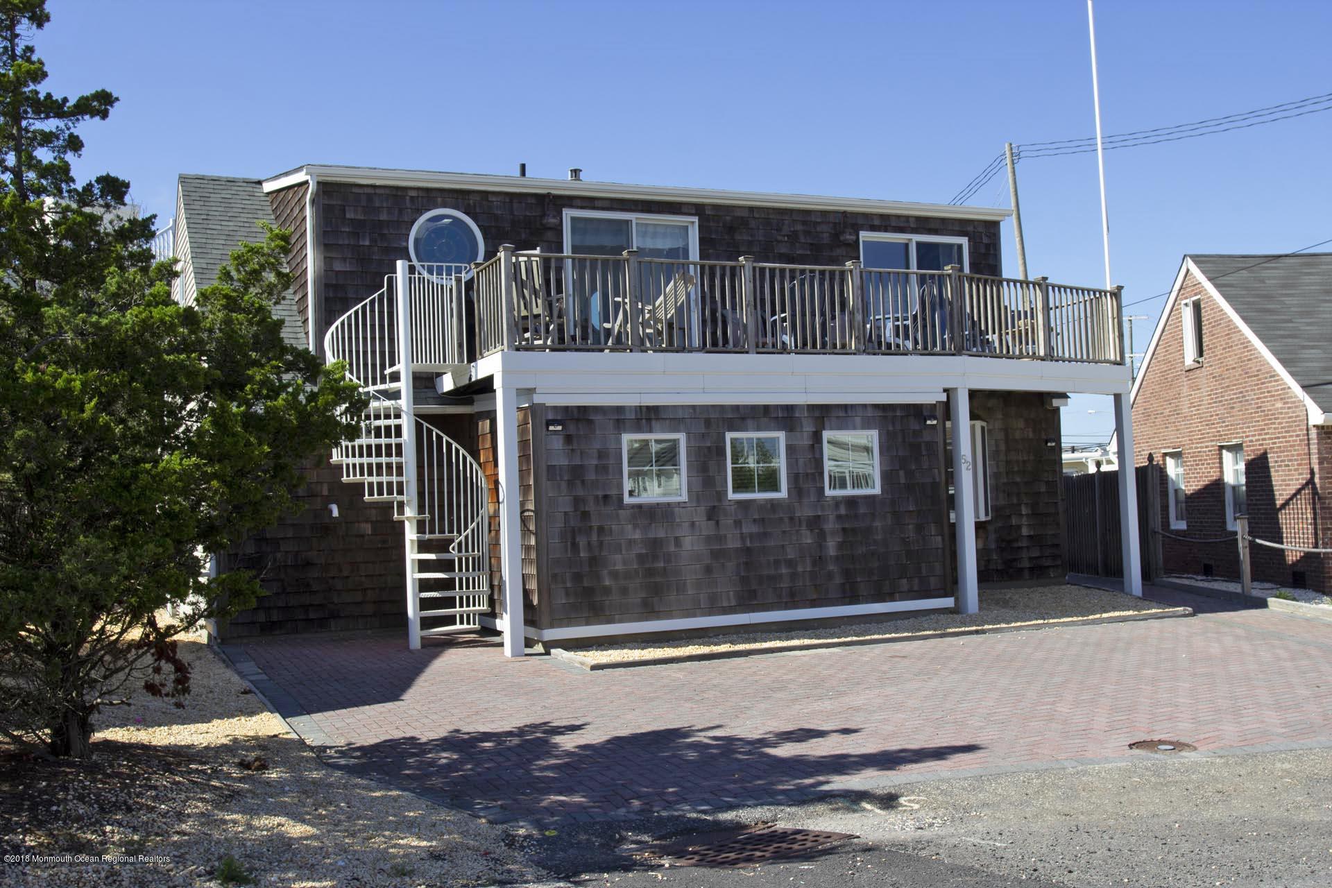 52 Fishermans Road Lavallette, NJ 08735 - Photo 4 of 74 a front view of a house with a yard