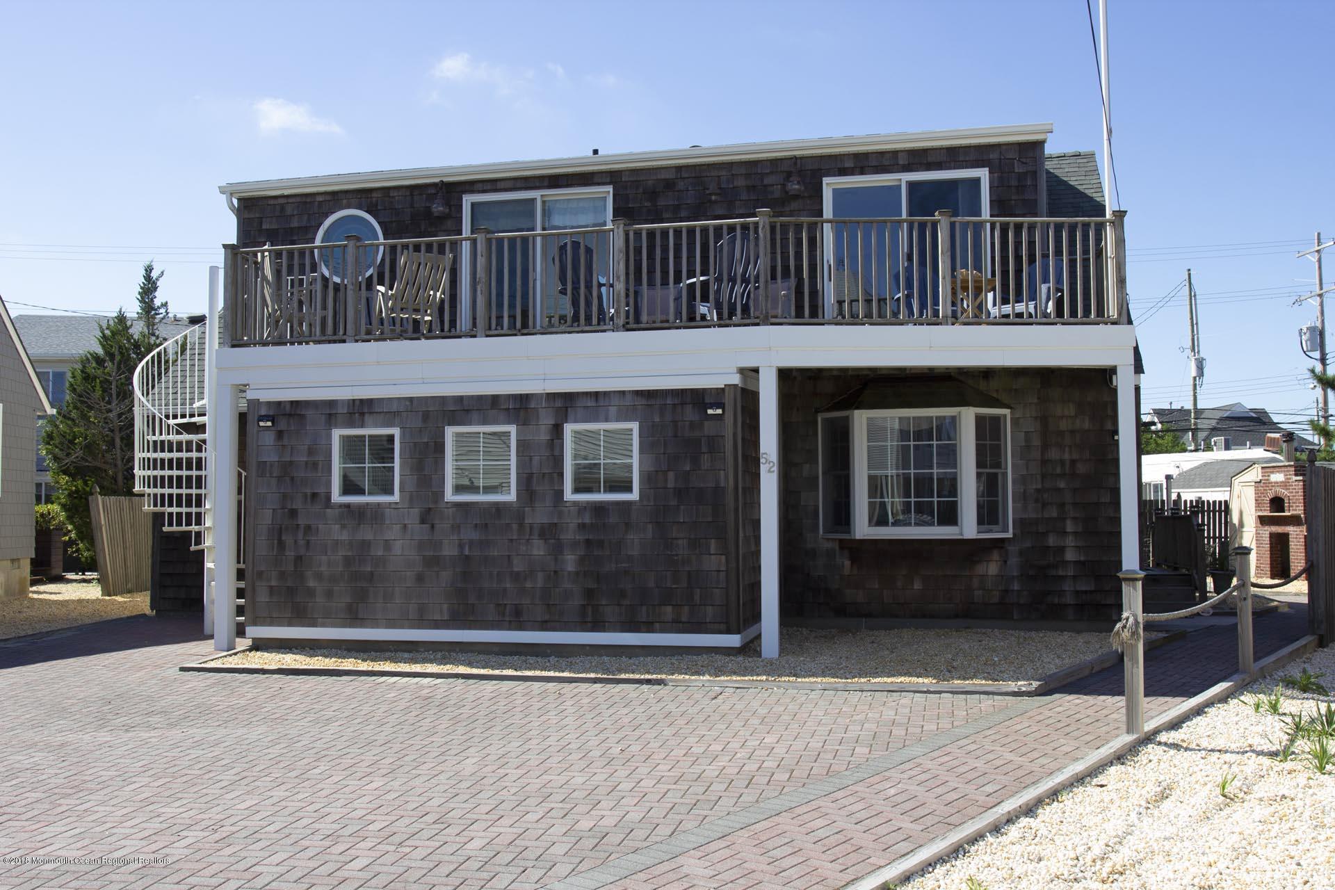 52 Fishermans Road Lavallette, NJ 08735 - Photo 5 of 74 a front view of a house with a yard