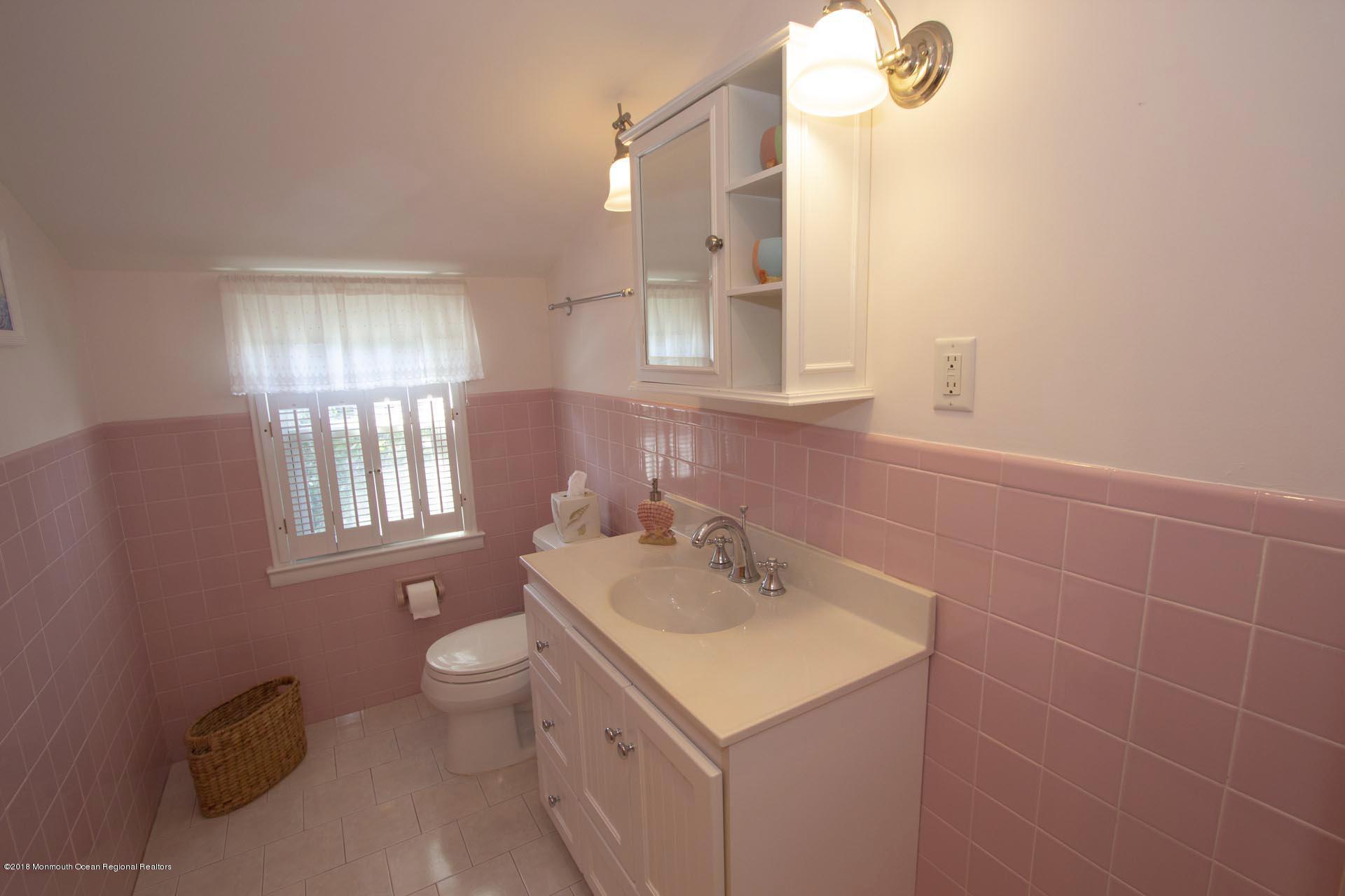 52 Fishermans Road Lavallette, NJ 08735 - Photo 43 of 74 a bathroom with a sink toilet and mirror