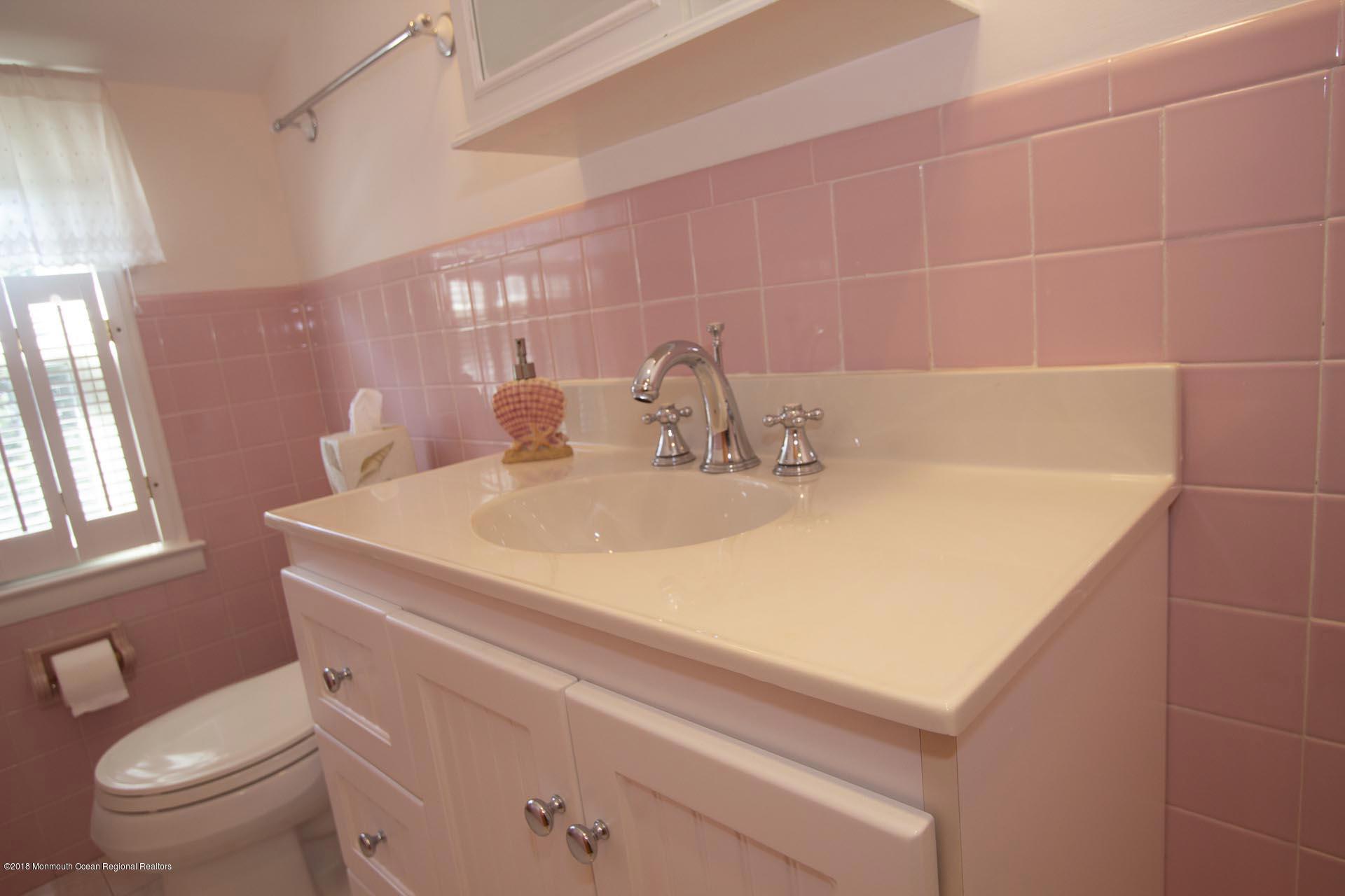 52 Fishermans Road Lavallette, NJ 08735 - Photo 44 of 74 a bathroom with a sink a toilet and shower