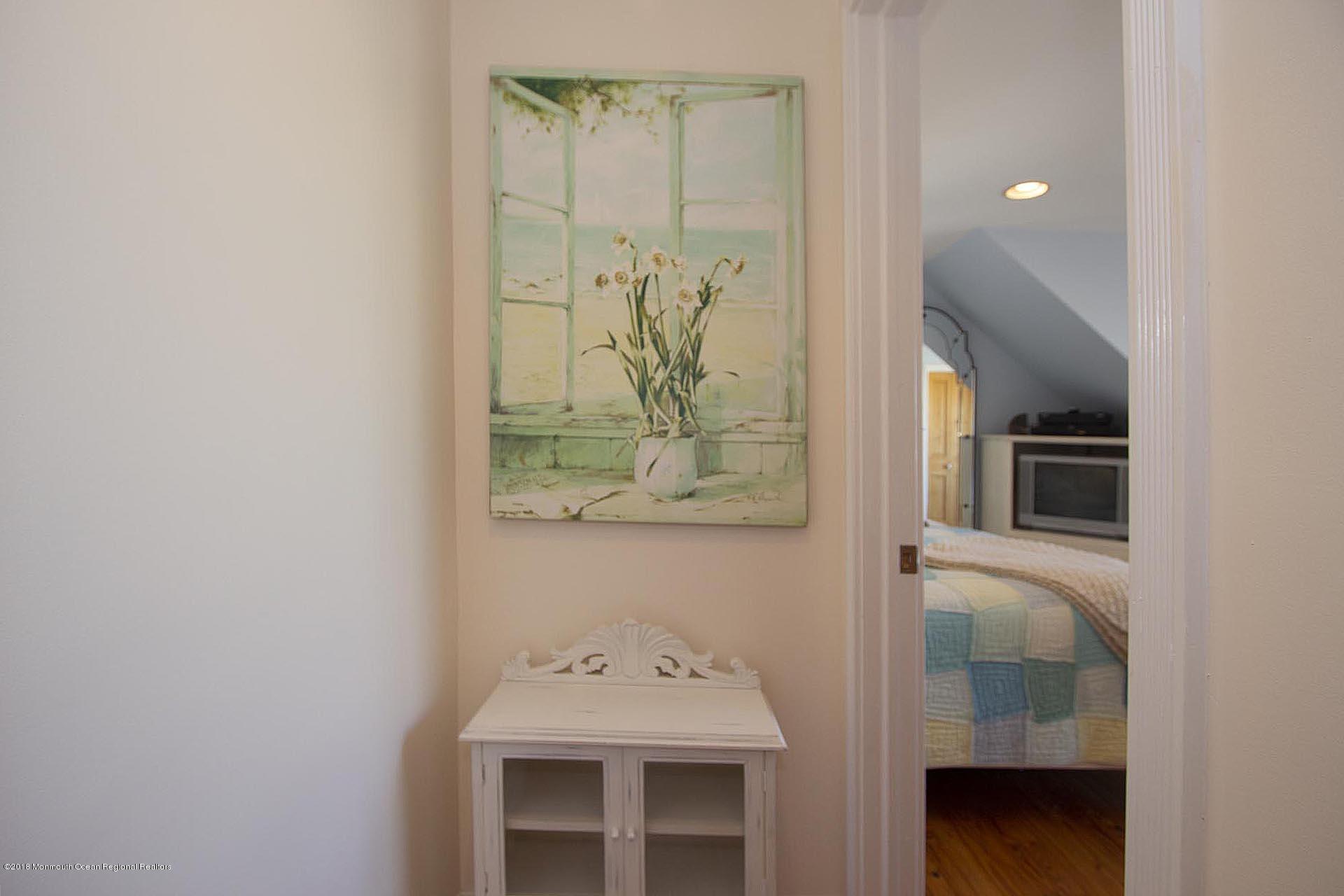 52 Fishermans Road Lavallette, NJ 08735 - Photo 45 of 74 a bathroom with a sink and a mirror