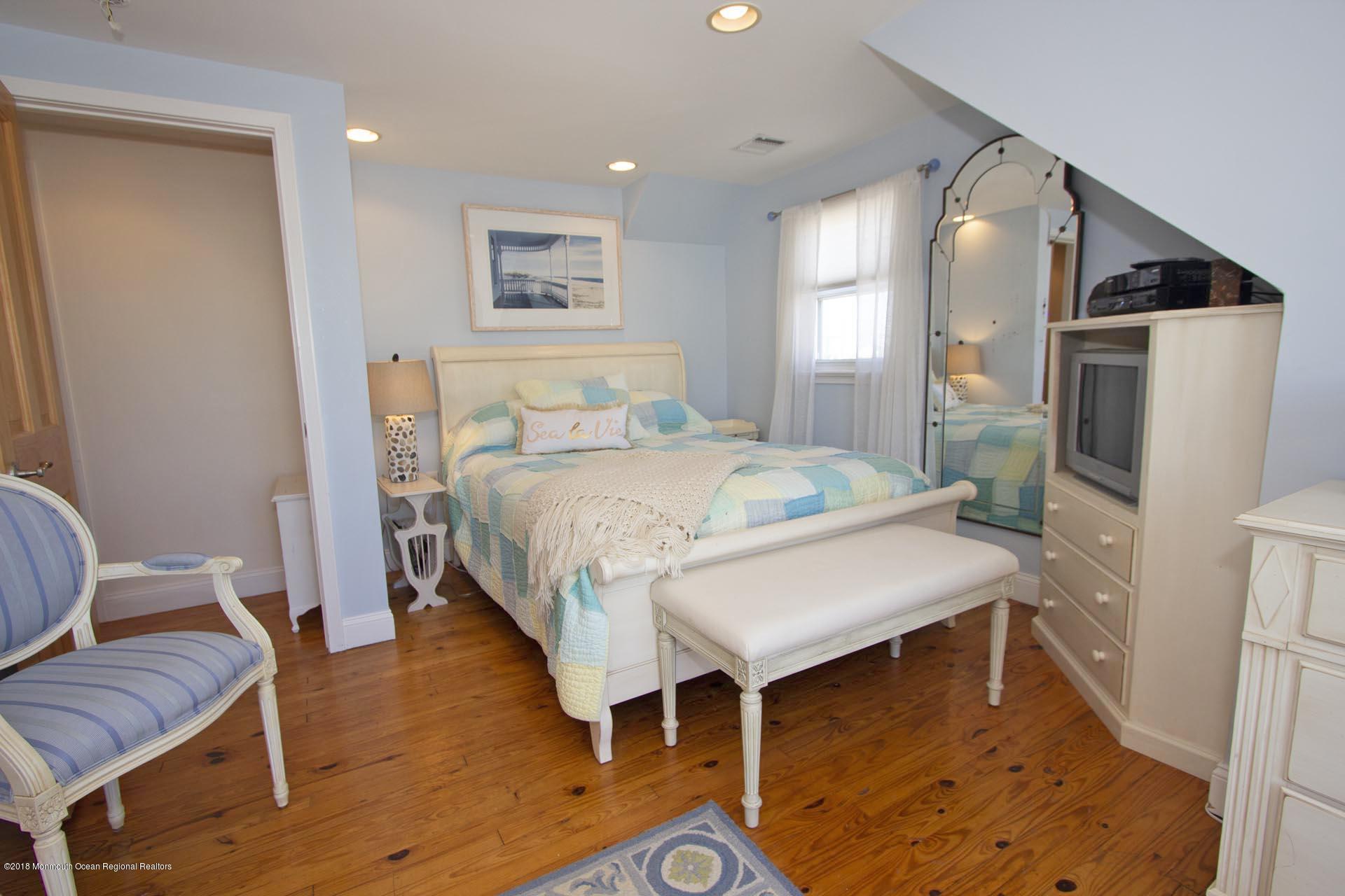 52 Fishermans Road Lavallette, NJ 08735 - Photo 47 of 74 a bedroom with a bed and a couch