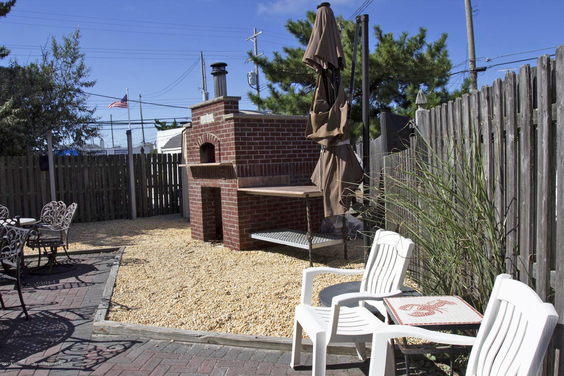 52 Fishermans Road Lavallette, NJ 08735 - Photo 58 of 74 a view of a chairs and tables in the patio