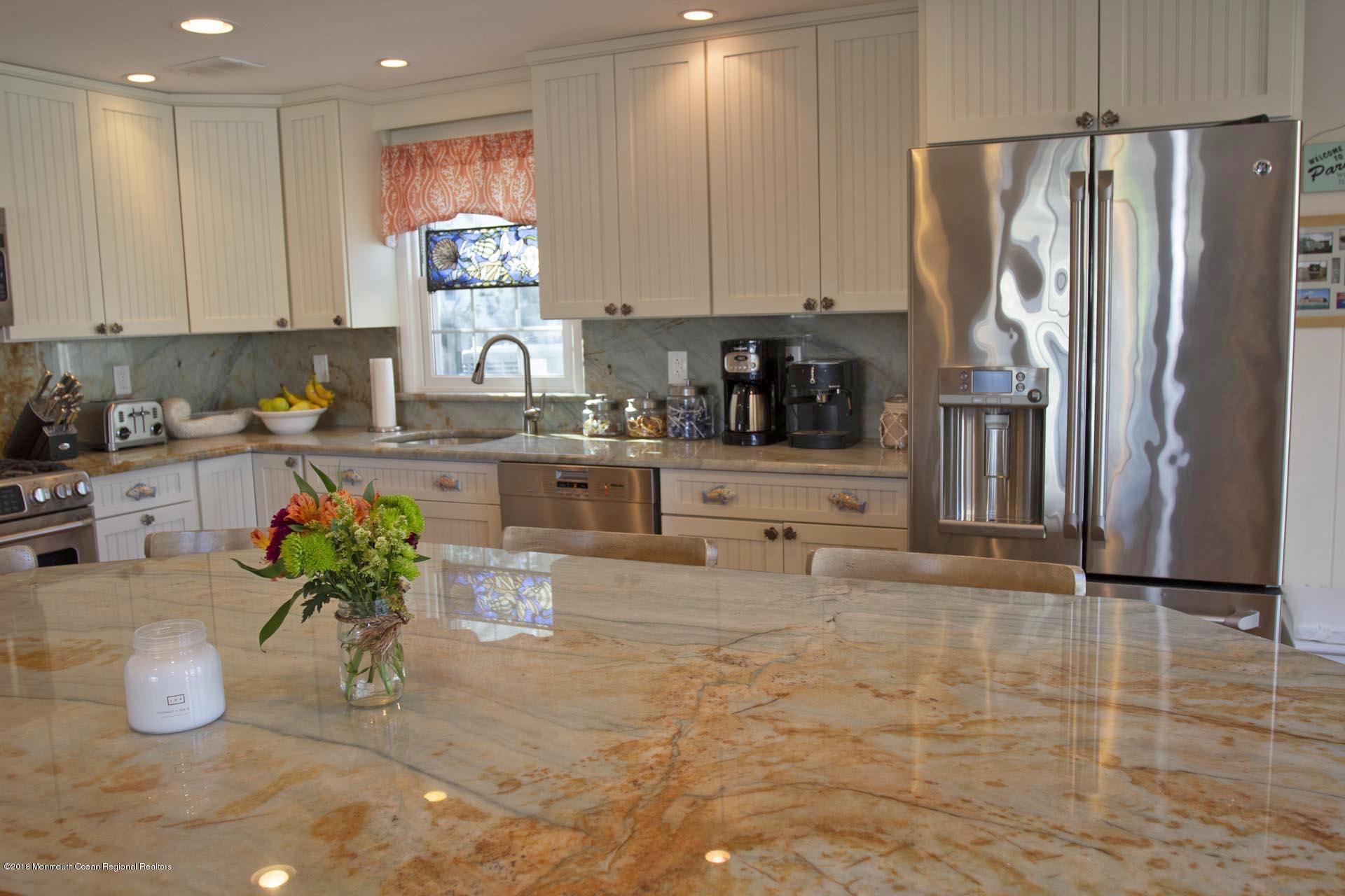52 Fishermans Road Lavallette, NJ 08735 - Photo 10 of 74 a kitchen with stainless steel appliances granite countertop a refrigerator a stove and a sink