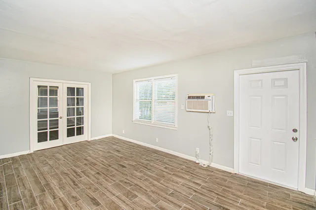 a view of empty room with windows