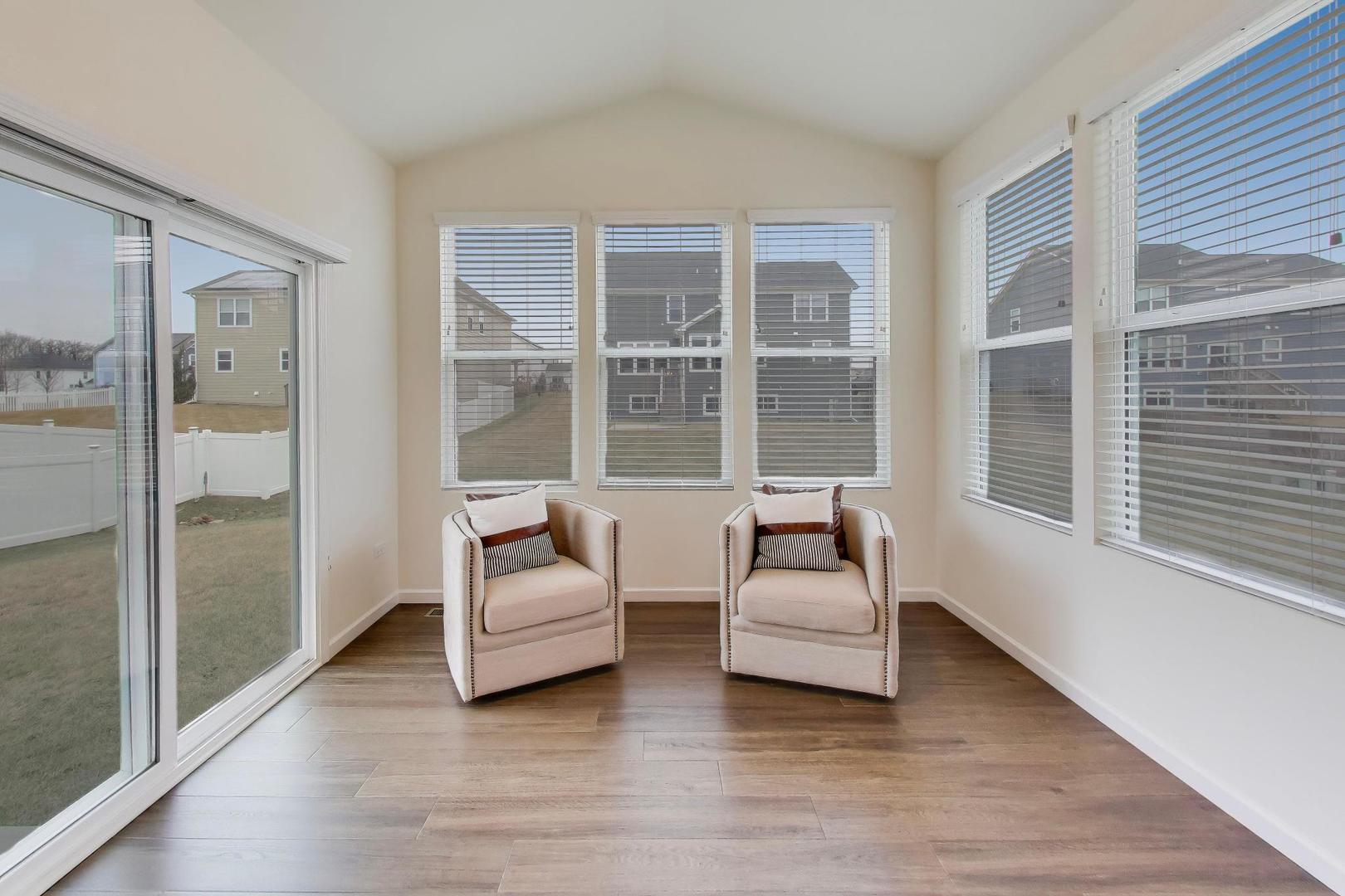 3744 Peregrine Way Elgin, IL 60124 - Photo 11 of 33 a living room with furniture and a large window
