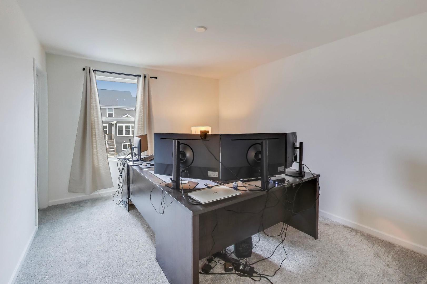 3744 Peregrine Way Elgin, IL 60124 - Photo 22 of 33 a living room with furniture a fireplace and a table